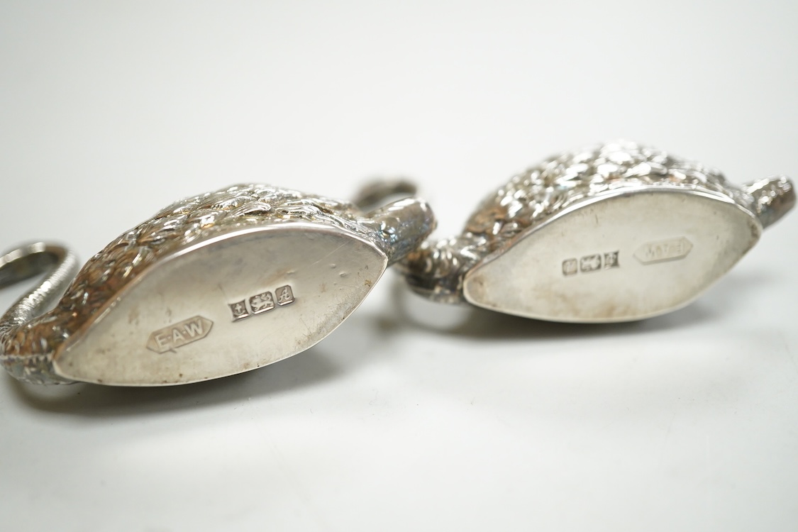 A pair of modern silver swan menu holders, maker E.A.W., Birmingham, 1975, height 44mm.